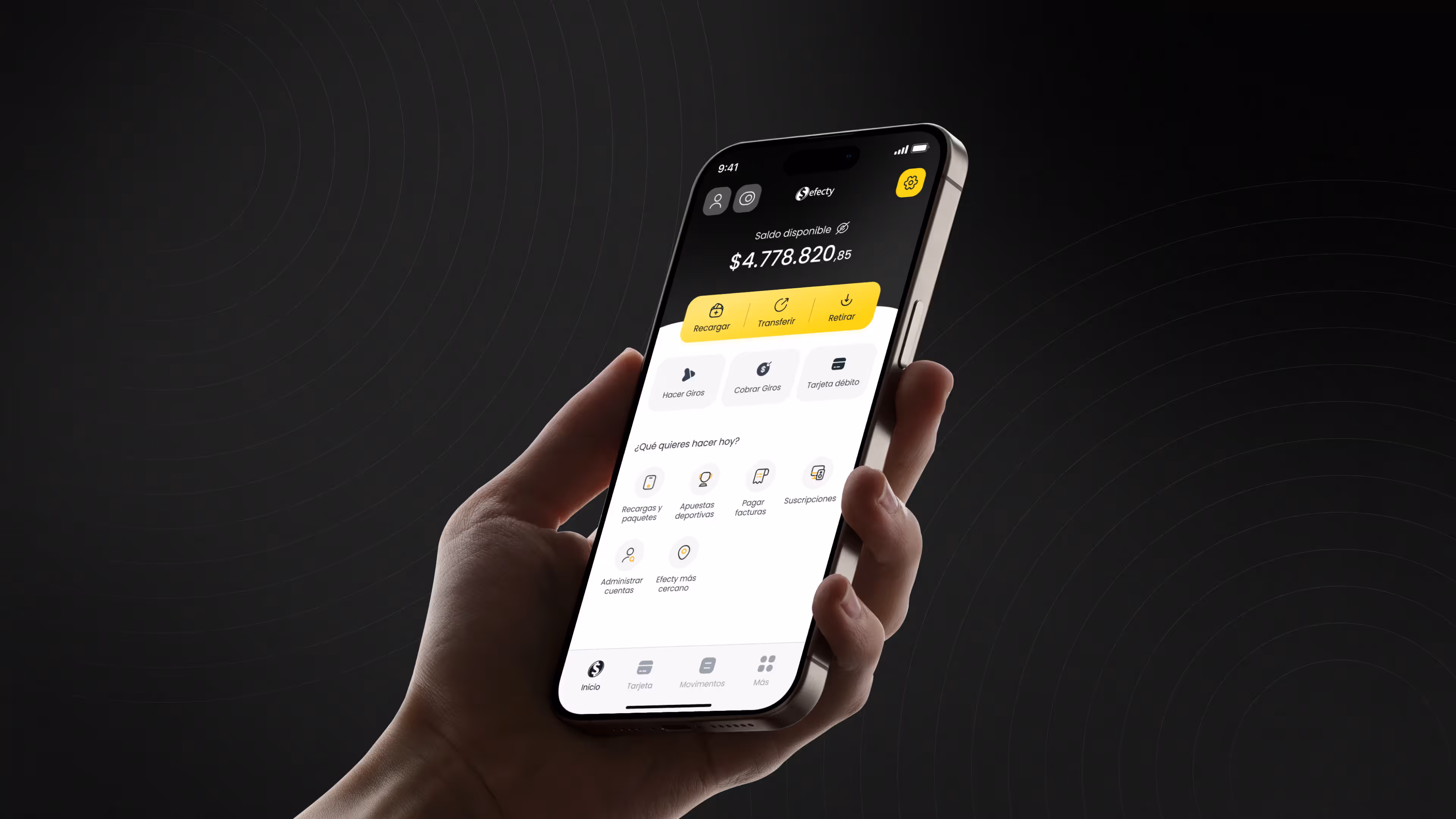 Efecty Wallet app redesign by NEA Studio — hand holding iPhone displaying the home screen with balance, quick actions and navigation on dark background